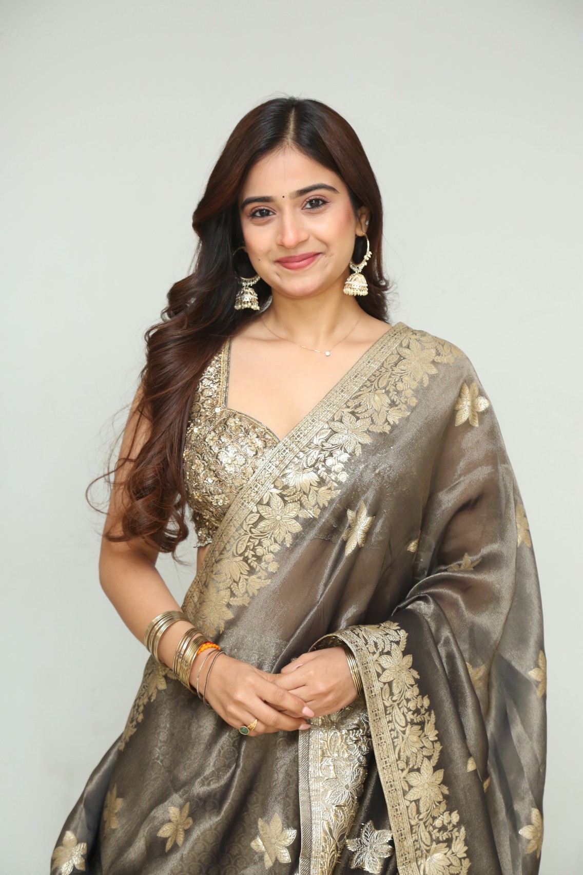 Saylim Chaudhari golden saree elegant portrait