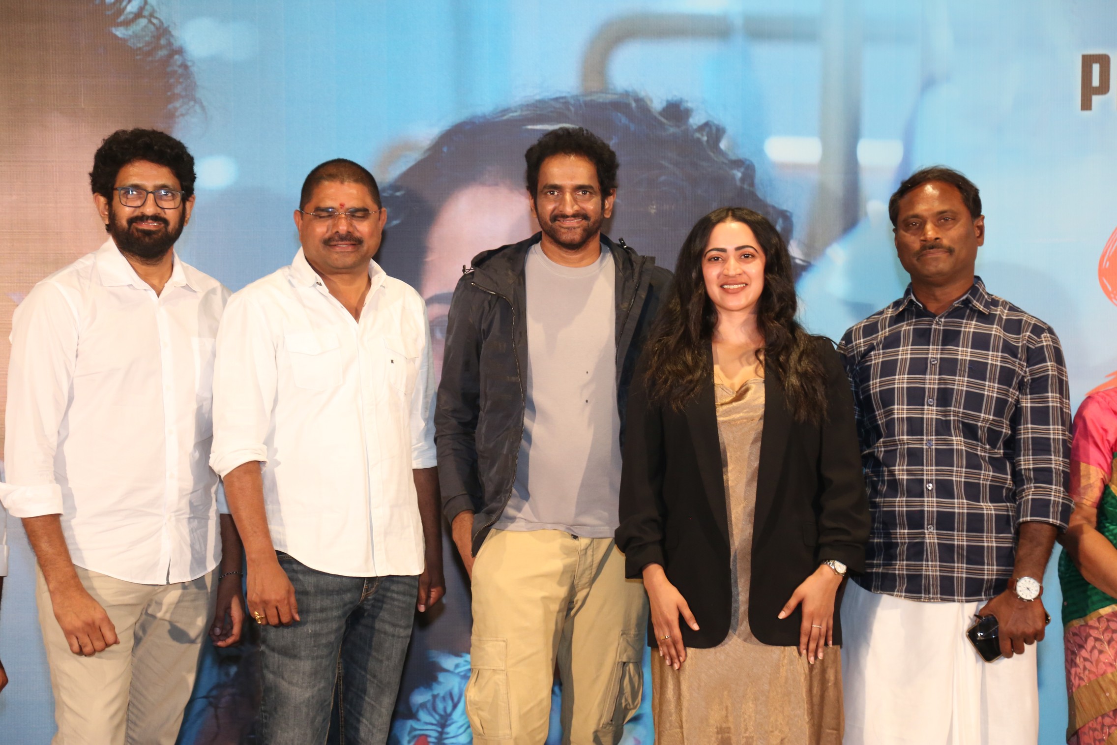 SKY film cast posing at promotional event