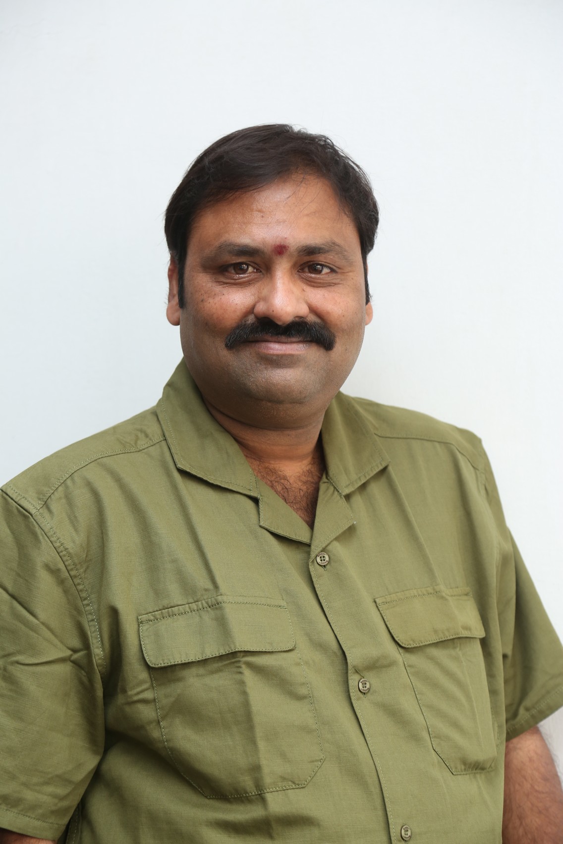Suman Babu confident in crisp khaki style