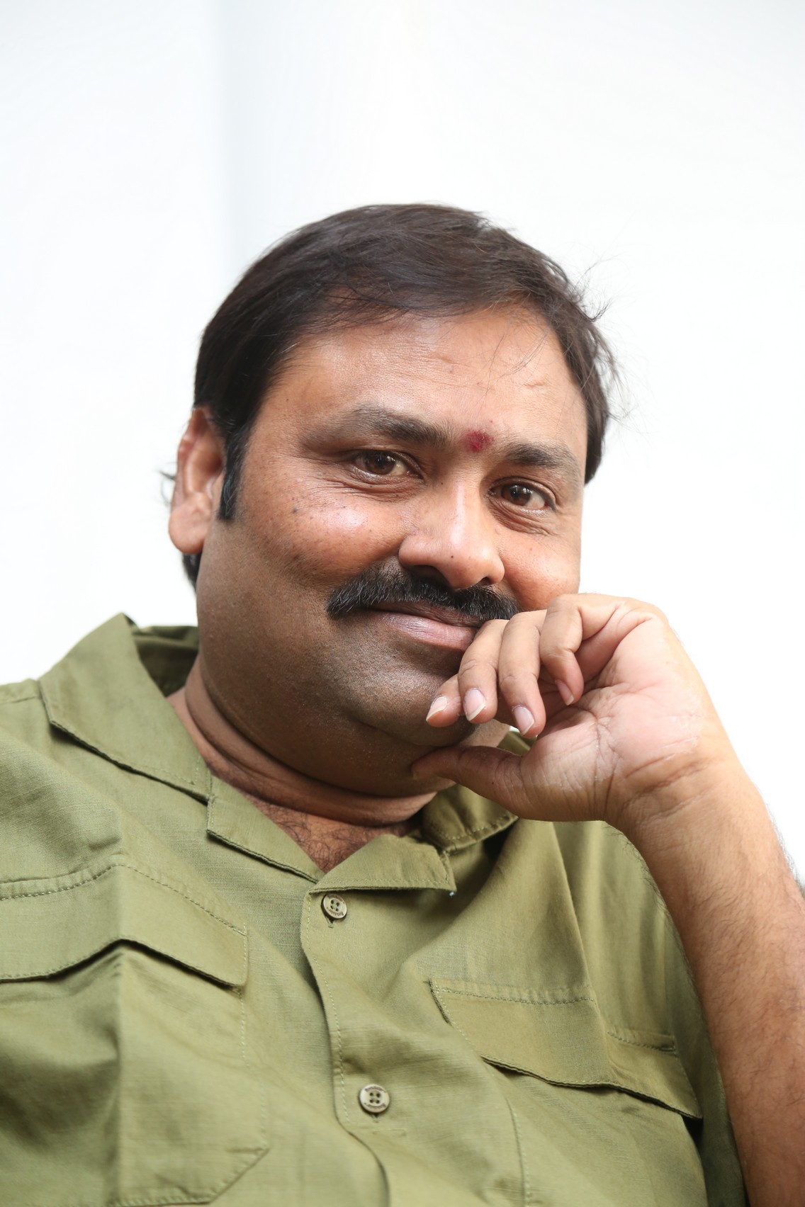 Suman Babu smiling sharp in professional look