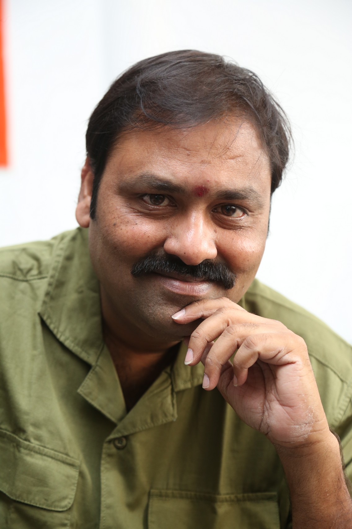 Suman Babu stylish grin with confident presence