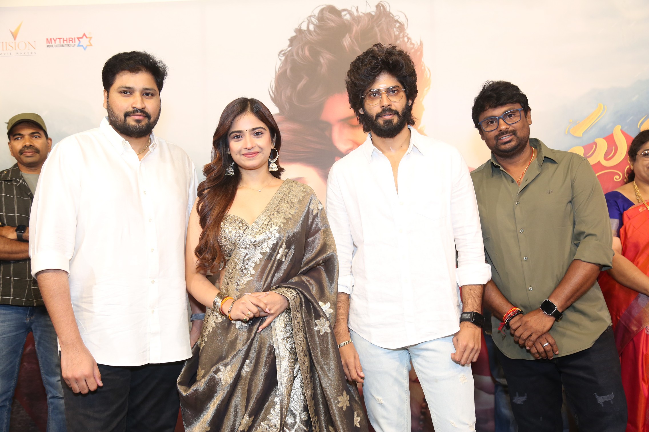 Cast and director posing at press meet