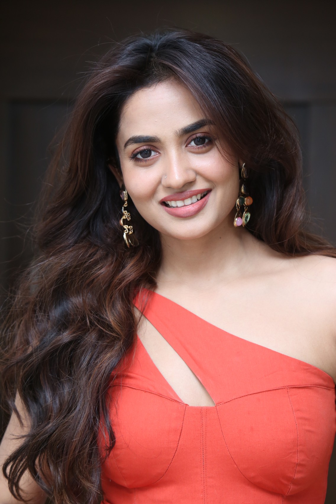 Teju Ashwini bold coral outfit with confidence