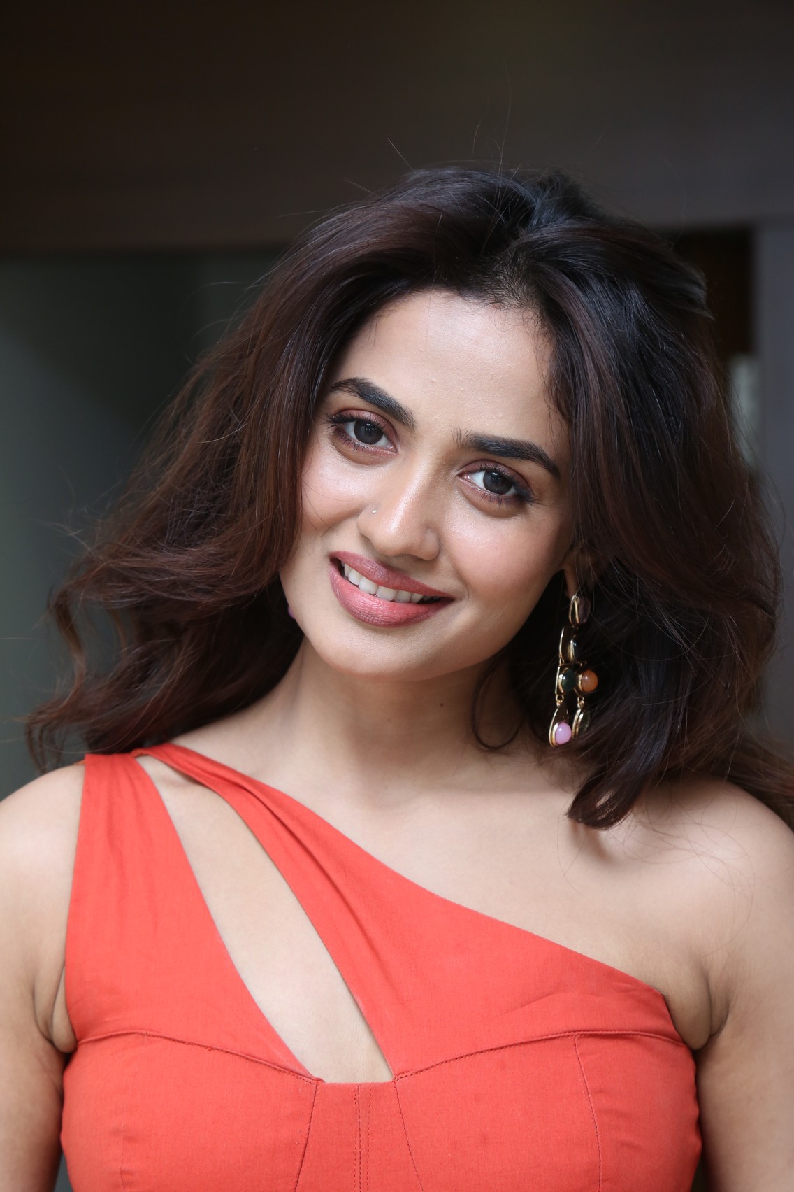 Teju Ashwini vibrant coral dress fashion moment
