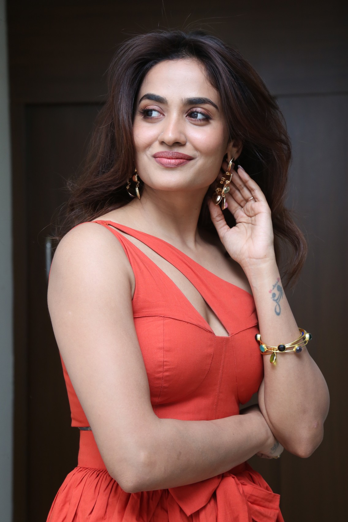 Teju Ashwini bold coral look playful smile