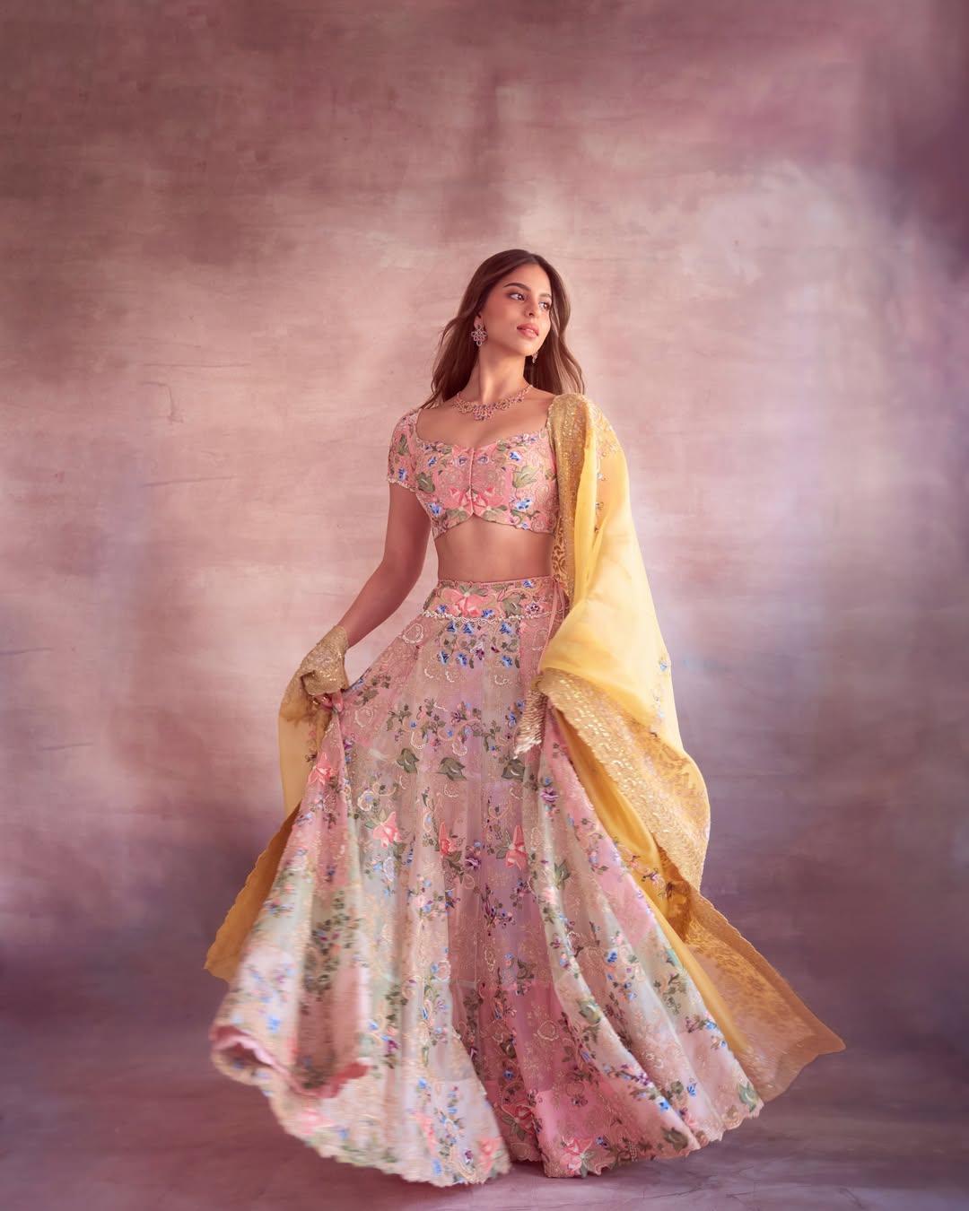 Suhana Khan wearing pastel embroidered lehenga with yellow dupatta