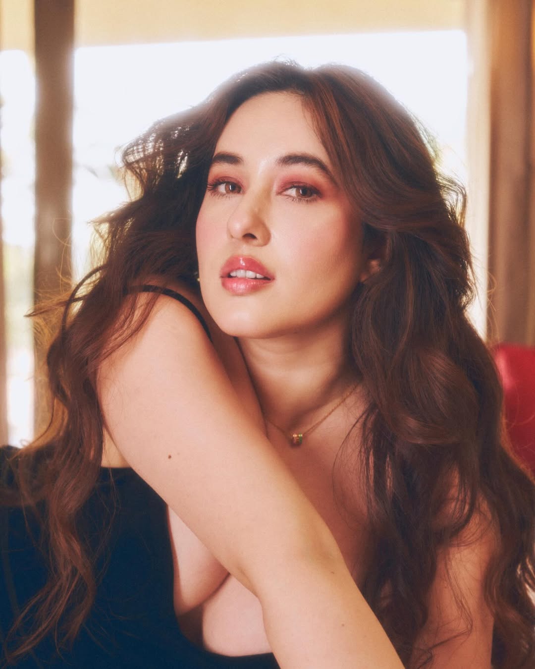 Aditi Budhathoki chic black dress elegant pose