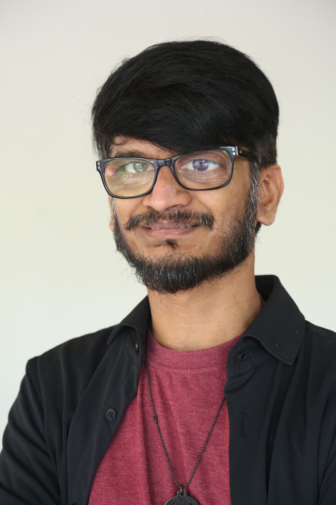 Ananth Sriram cool look with glasses and charming smile