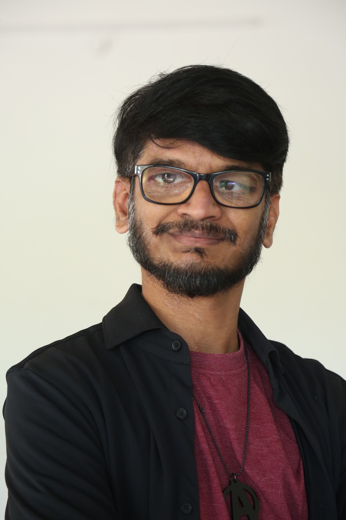 Ananth Sriram sharp fashion style with signature glasses