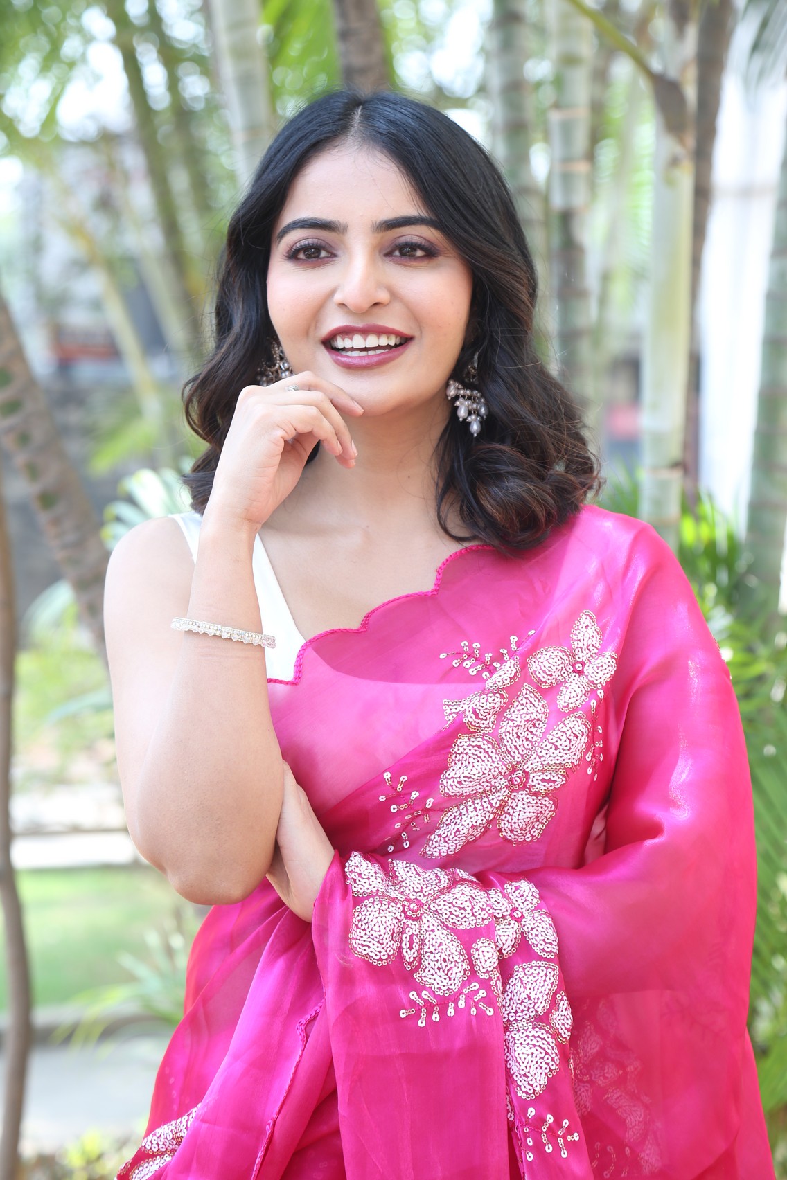Ananya Nagalla smiling in vibrant pink saree
