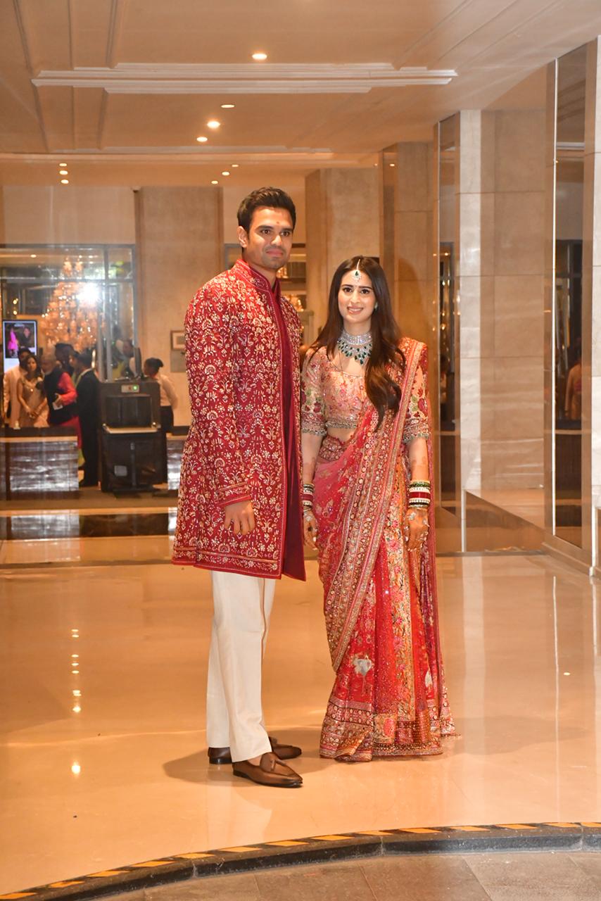 Arjun Tendulkar and Saaniya Chandhok posing at wedding ceremony