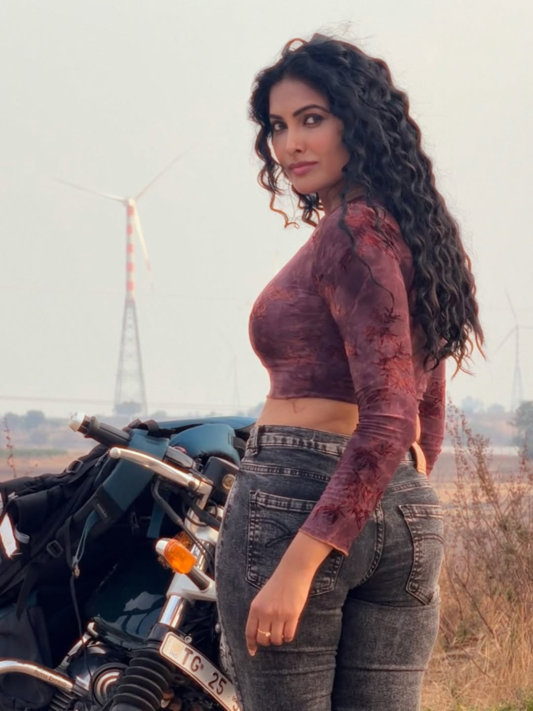 Divi Vadthya stylish bike ride bold fashion pose