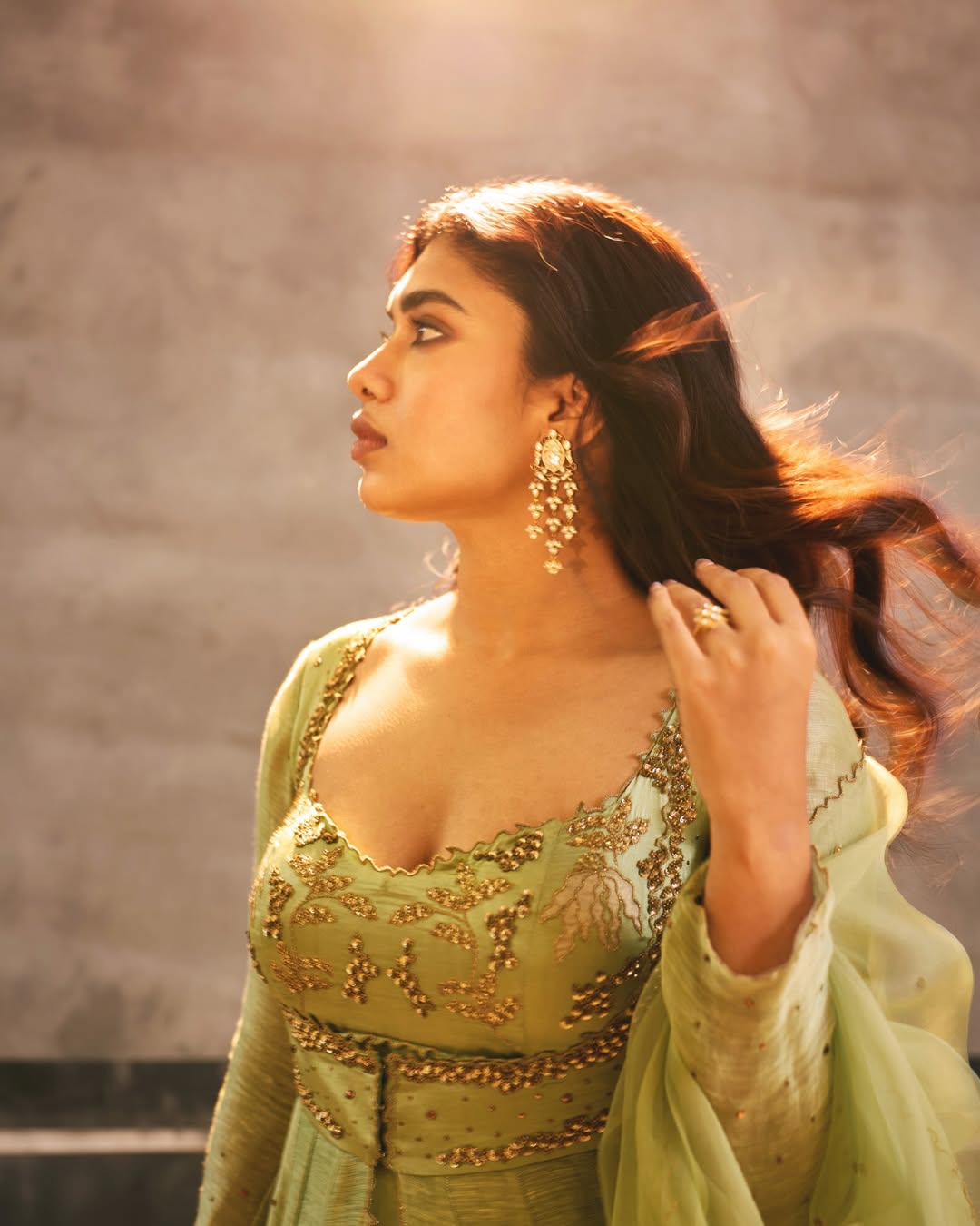 Dushara Vijayan stunning green outfit with bold stylish presence