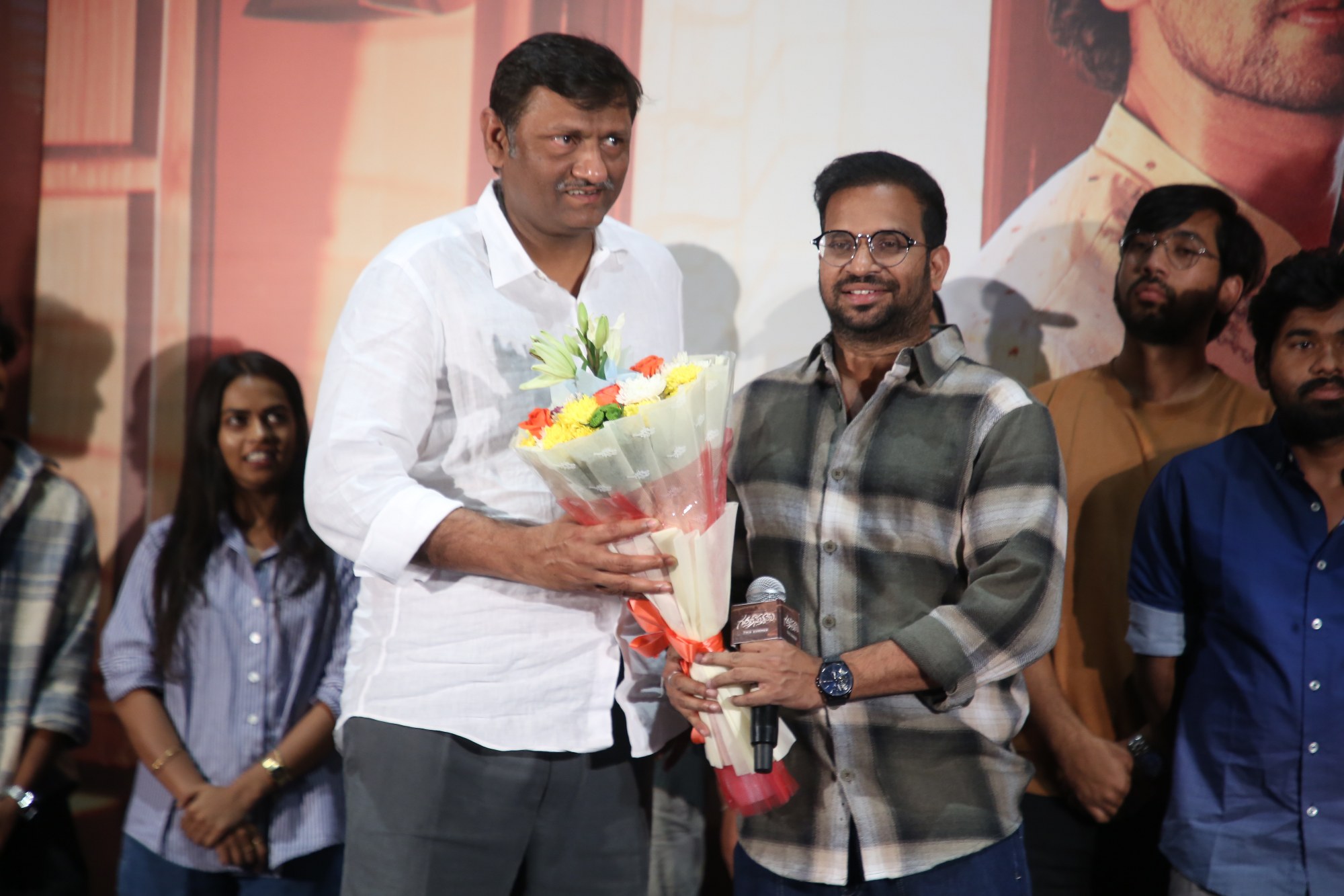 Naveen Yerneni welcomed by Sarath Chandra with bouquet on stage