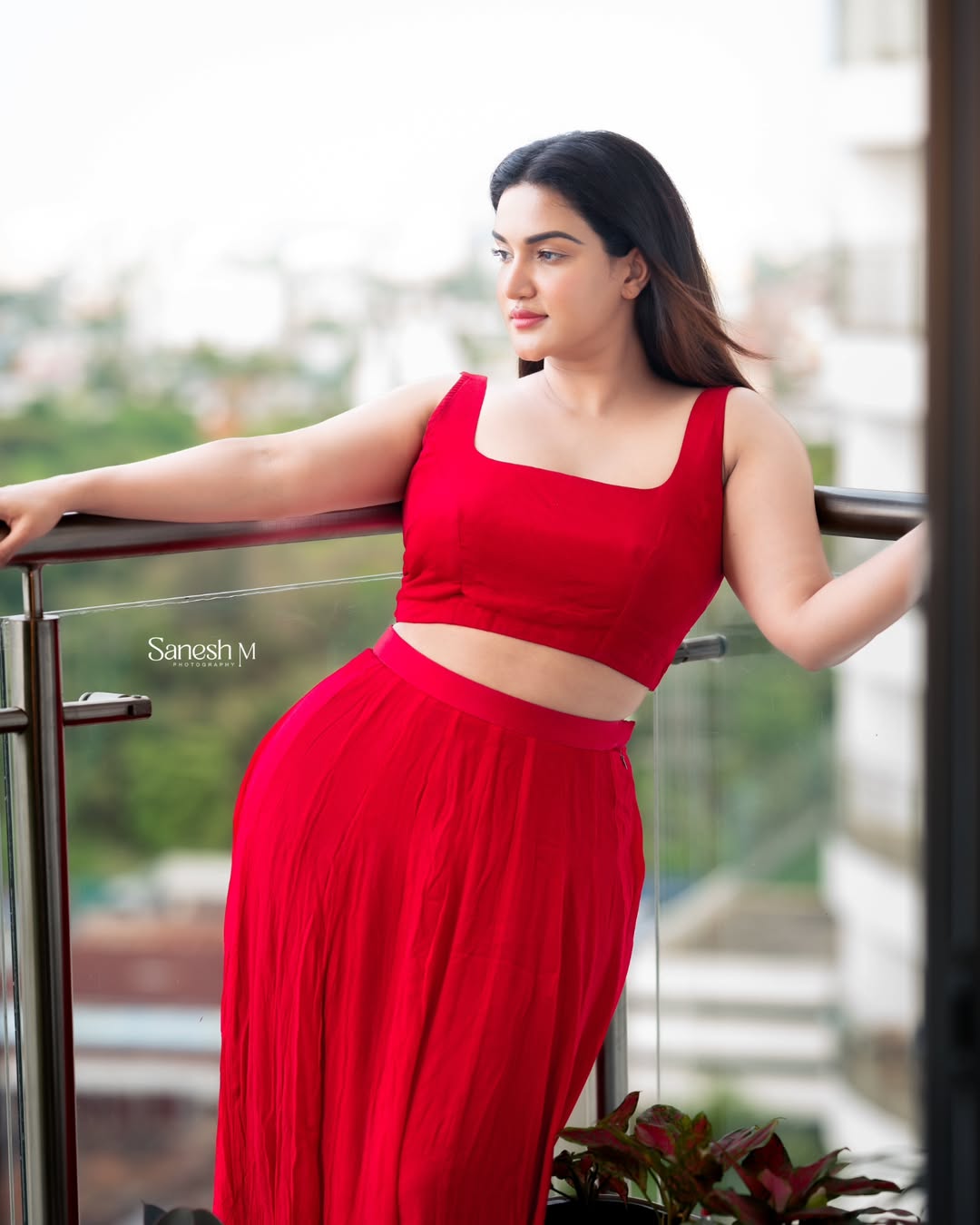 Honey Rose elegant red ensemble confident fashion pose