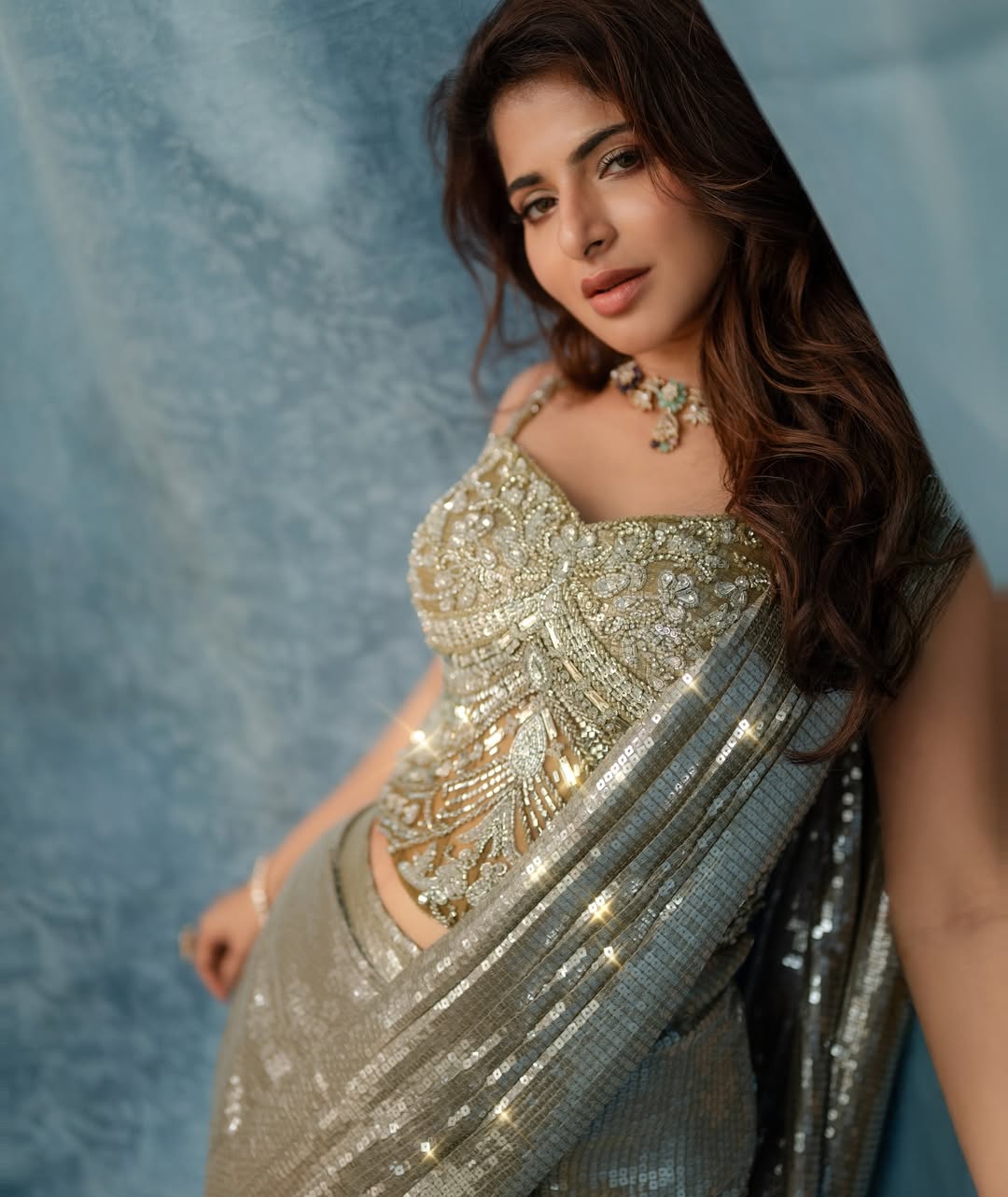 Iswarya Menon golden outfit radiant elegant stylish pose