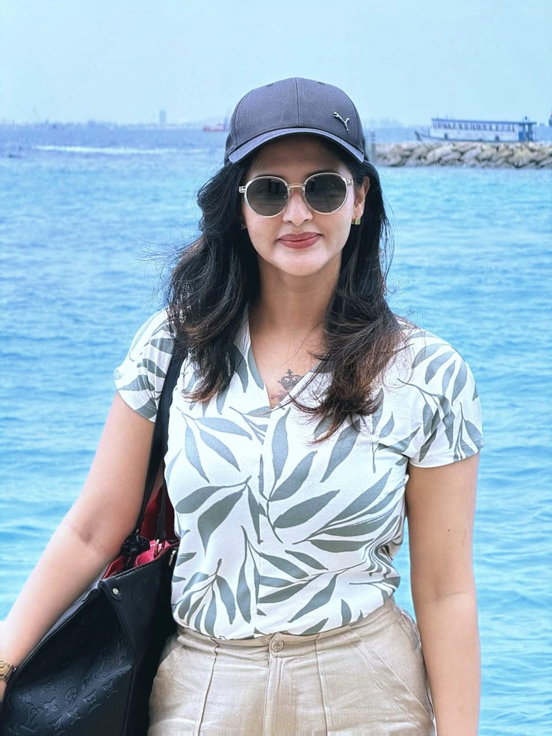 Jyothi Rai seaside look with hat and sunglasses