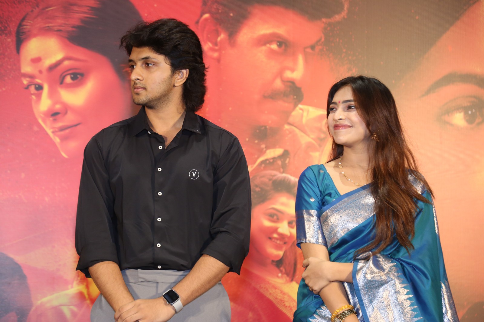 Vaishnav and Aishwarya seated together at event