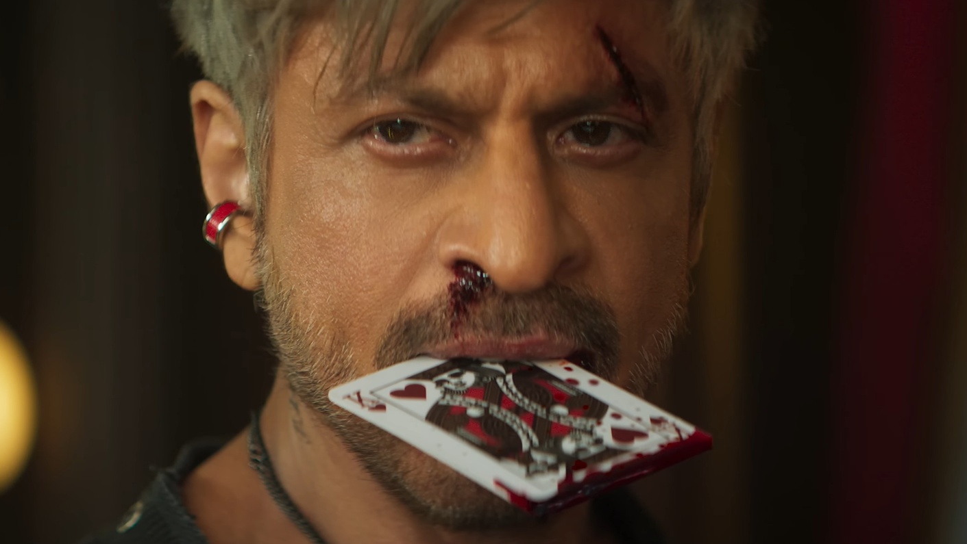 Shah Rukh Khan intense look holding king card