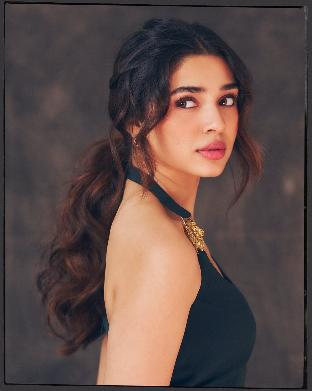 Krithi Shetty black dress with gold jewellery style