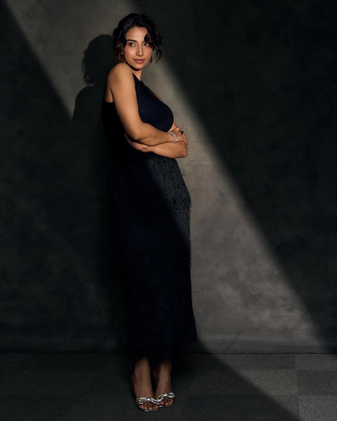 Meenakshi Chaudhary sparkling elegant black outfit stylish pose