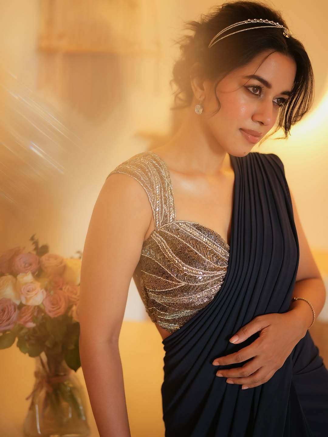 Mirnalini Ravi shimmering dress with bold elegant style