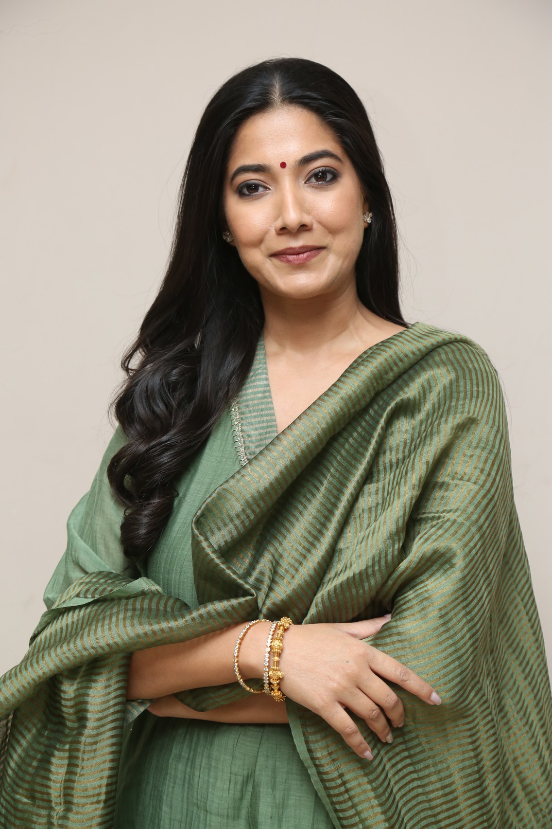 Pooja Sarathkumar green ensemble with sparkling elegance