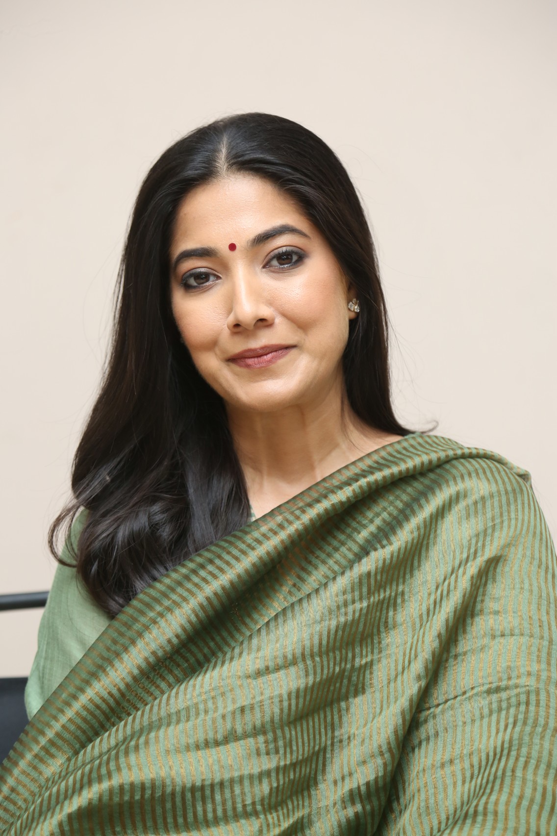 Pooja Sarathkumar timeless elegance in green saree