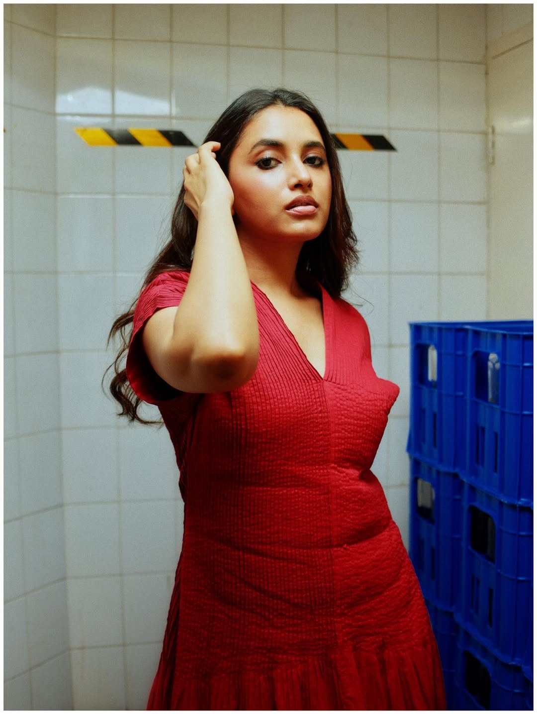 Priyanka Mohan red outfit with glamorous stylish presence