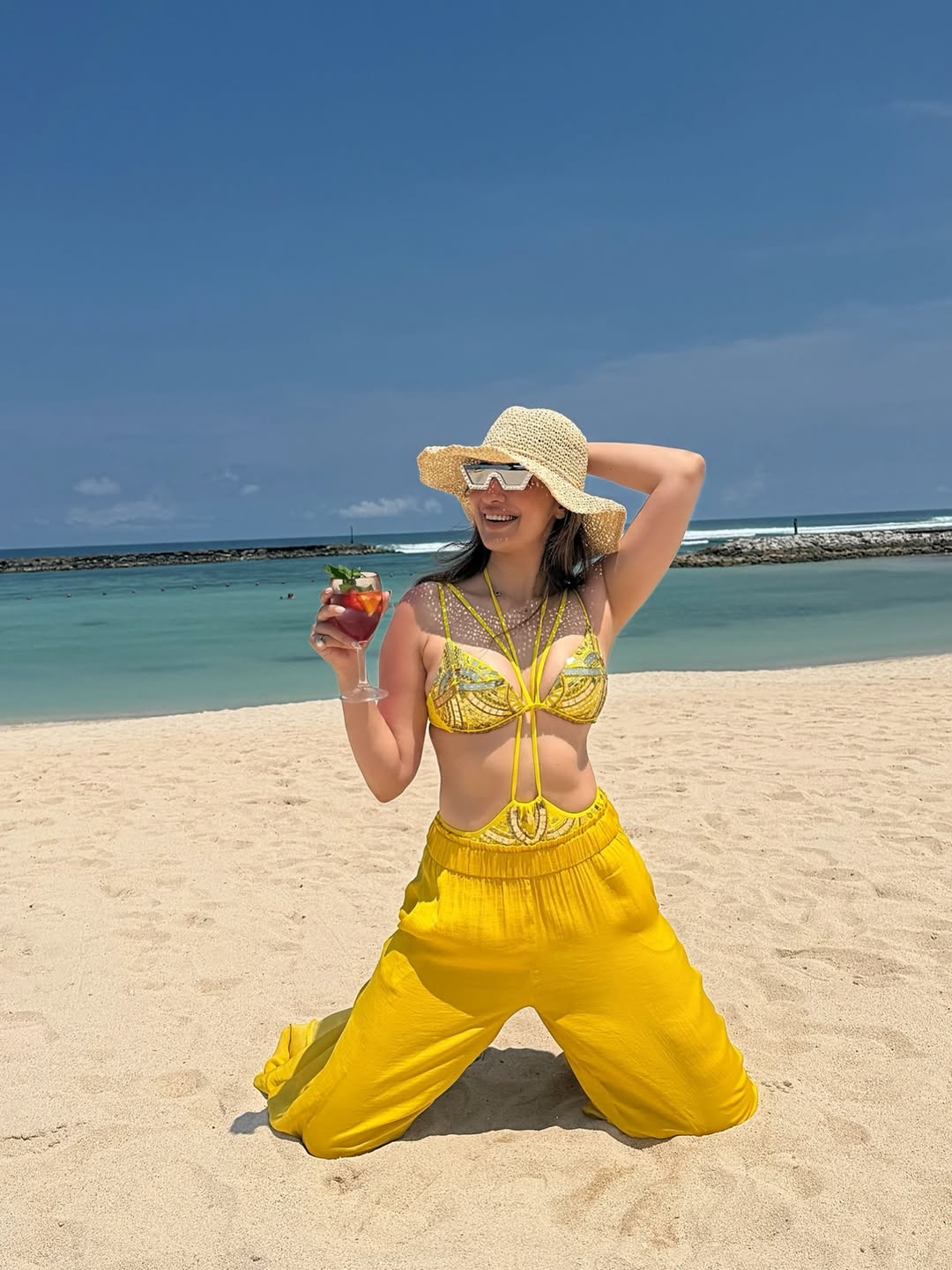 Raai Laxmi elegant beach pose with stylish outfit