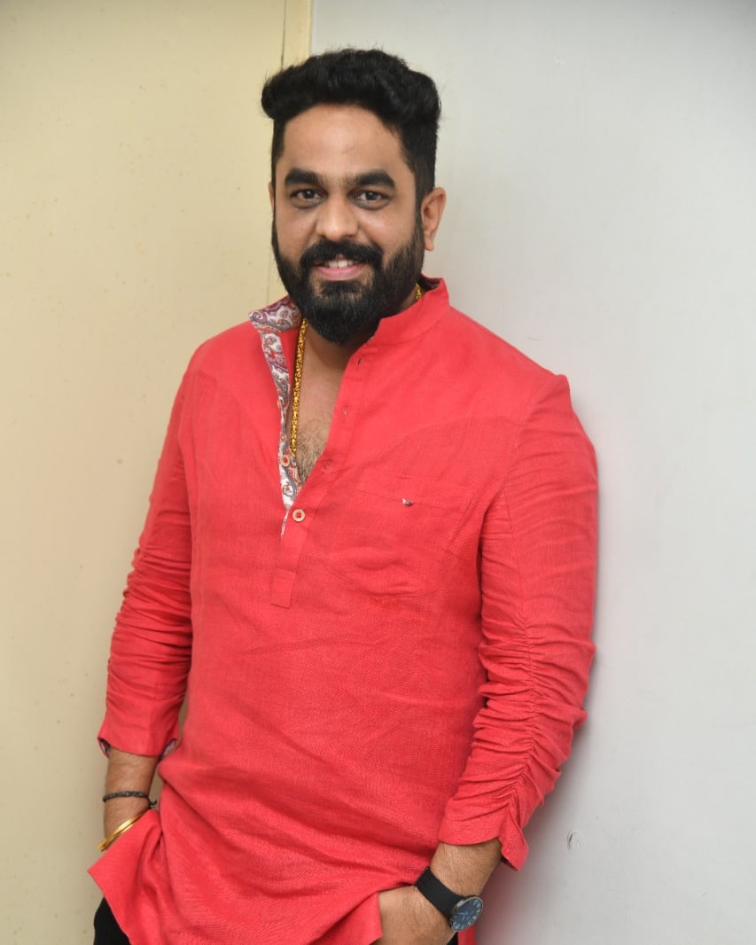 Raghu Bhat bold red outfit confident style