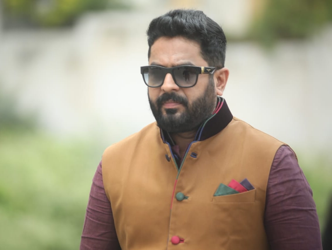 Raghu Bhat jacket and sunglasses stylish look