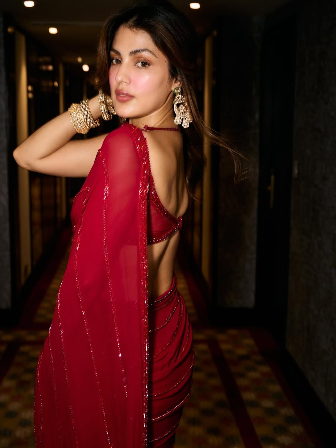 Rhea Chakraborty red saree glam grace captivating smile