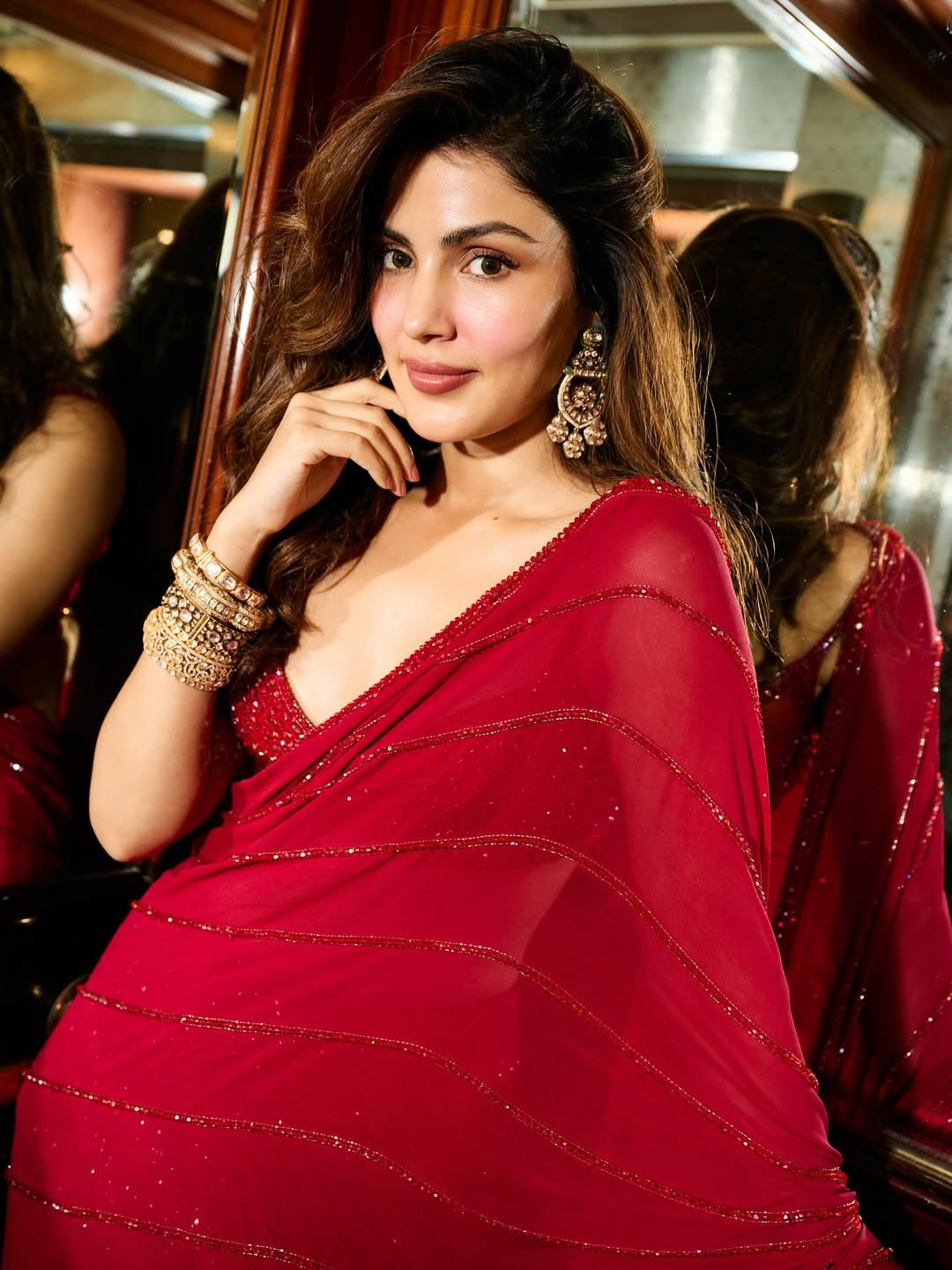 Rhea Chakraborty stylish red saree elegant confident pose