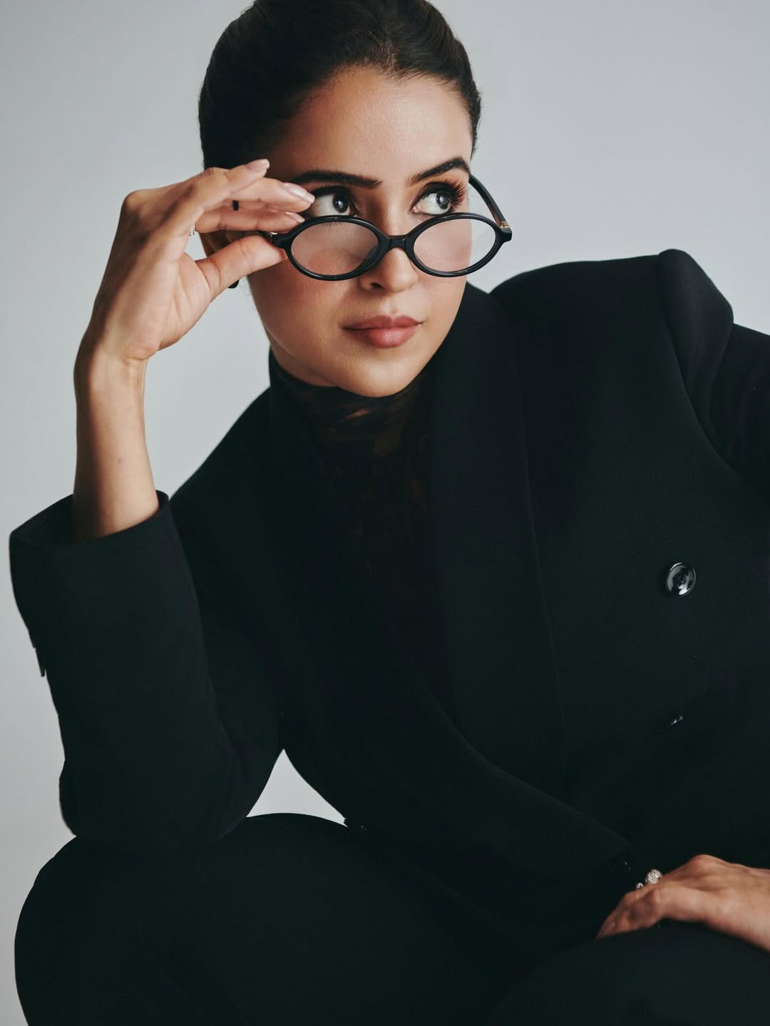 Sanya Malhotra chic blazer and glasses stylish portrait