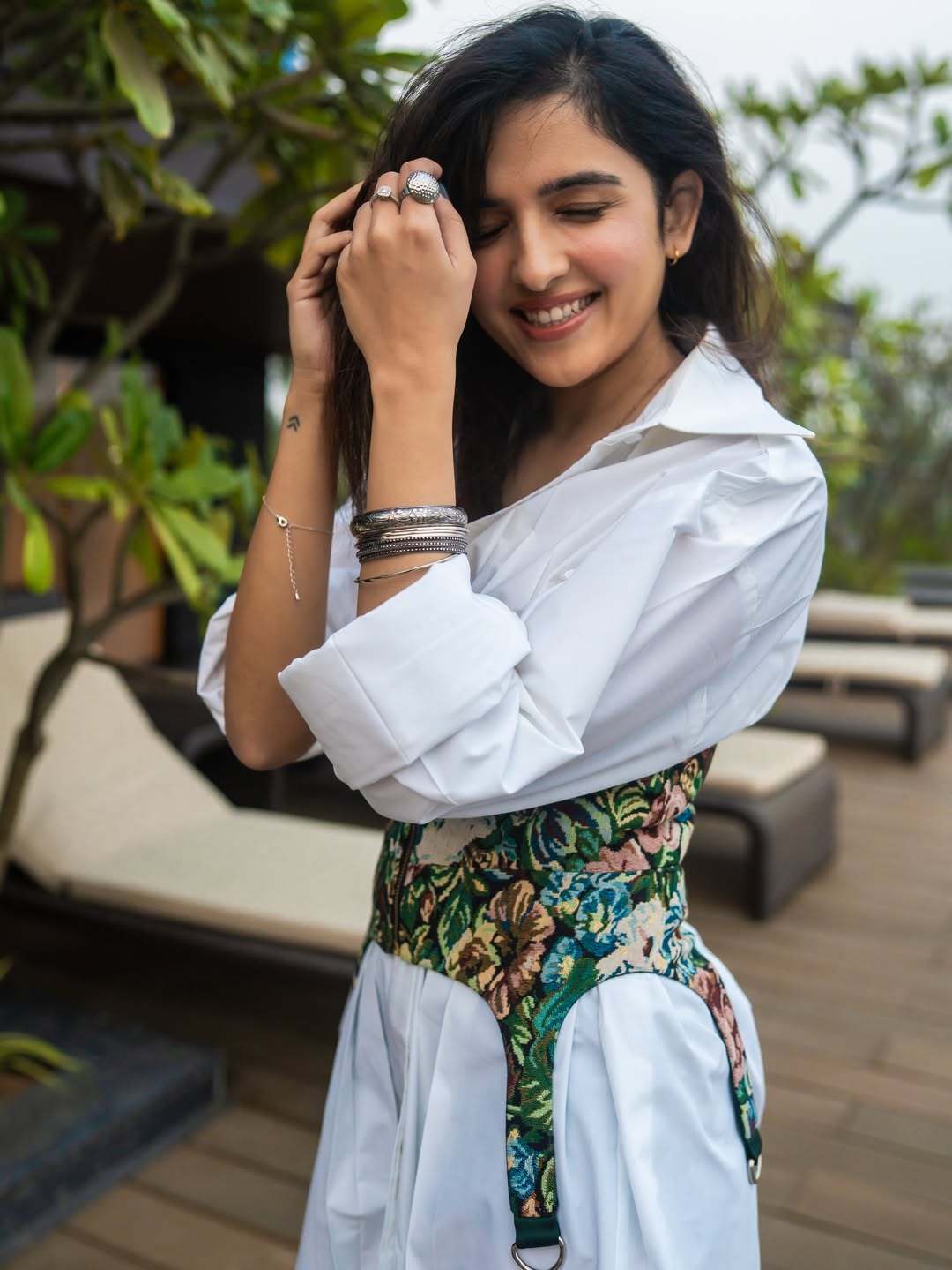 Shirley Setia stylish white dress balcony pose smile
