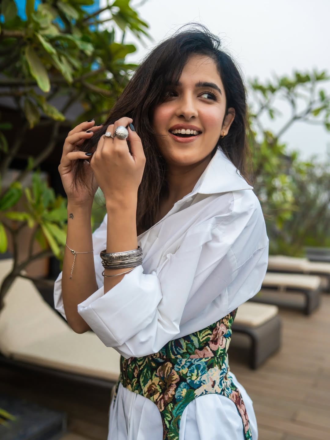 Shirley Setia chic balcony style with confident smile