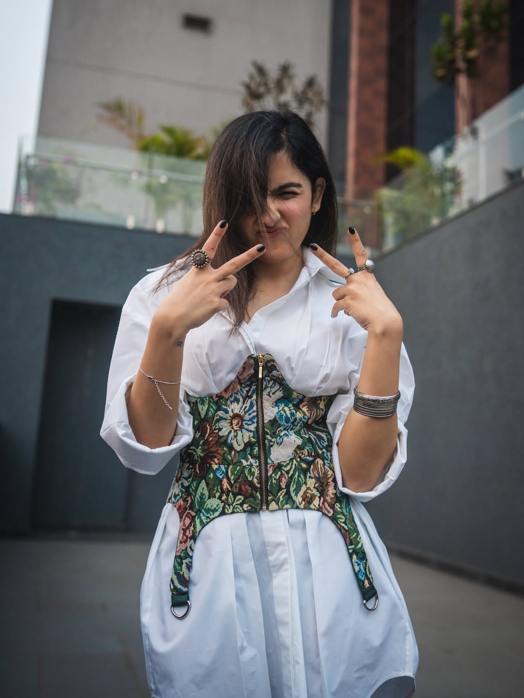 Shirley Setia playful peace sign stylish casual look