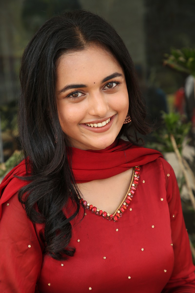 Smeha Manimegalai bright smile red dress stylish look