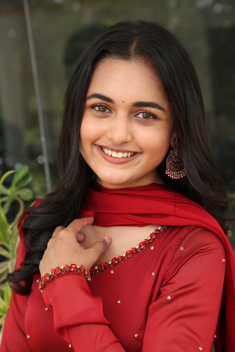 Smeha Manimegalai red outfit chic confident stylish pose