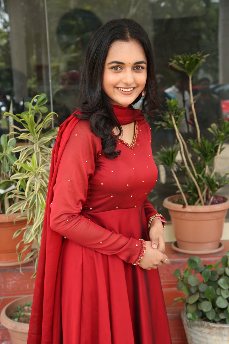 Smeha Manimegalai sophisticated red look stylish confident pose