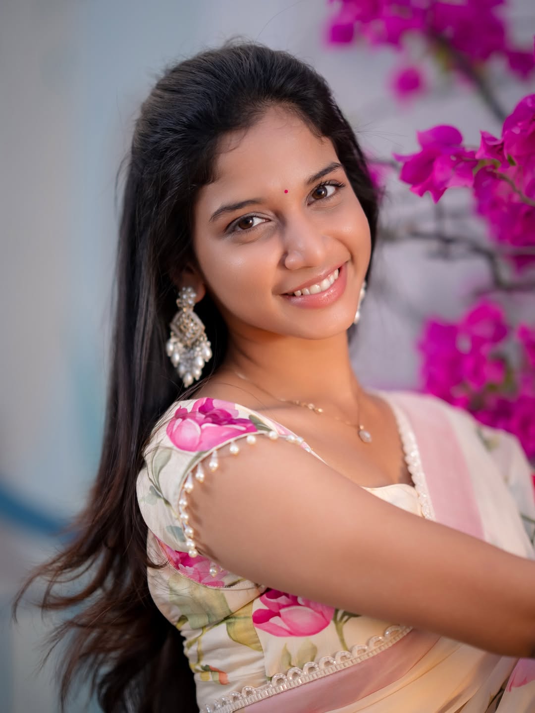 Sridevi Apalla floral saree radiant smile elegant pose