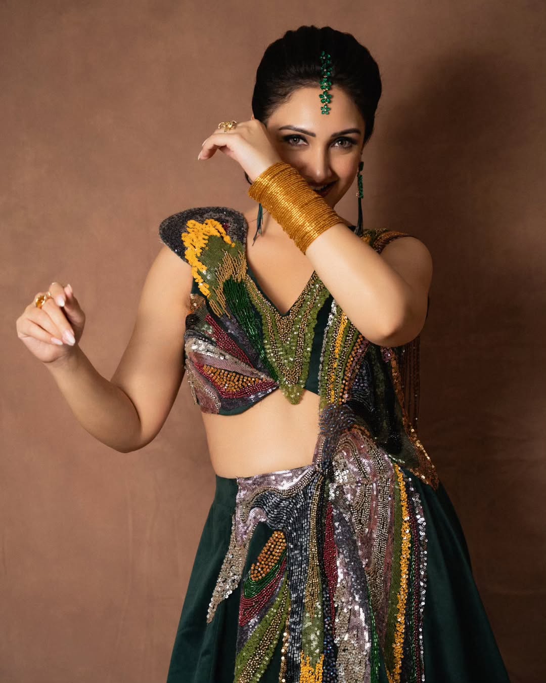 Sridevi Vijaykumar stylish ensemble with sparkle elegant pose