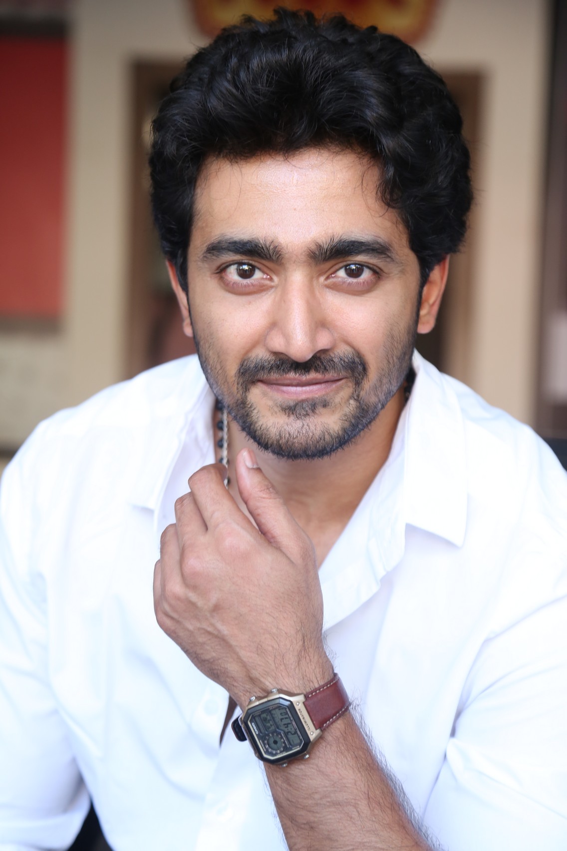 Srinath Maganti sharp gaze in white attire