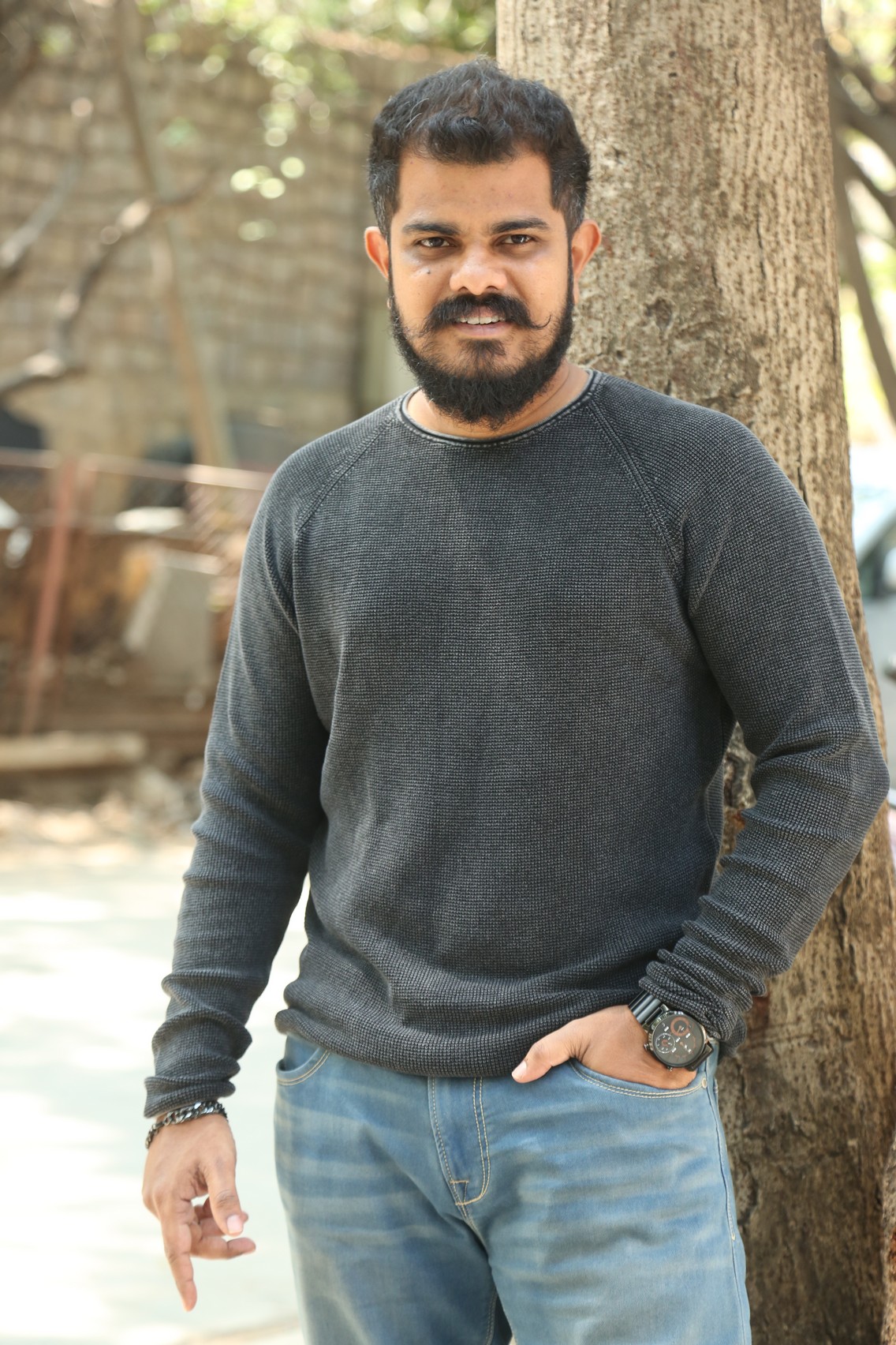 Sudhan confident stance with stylish beard