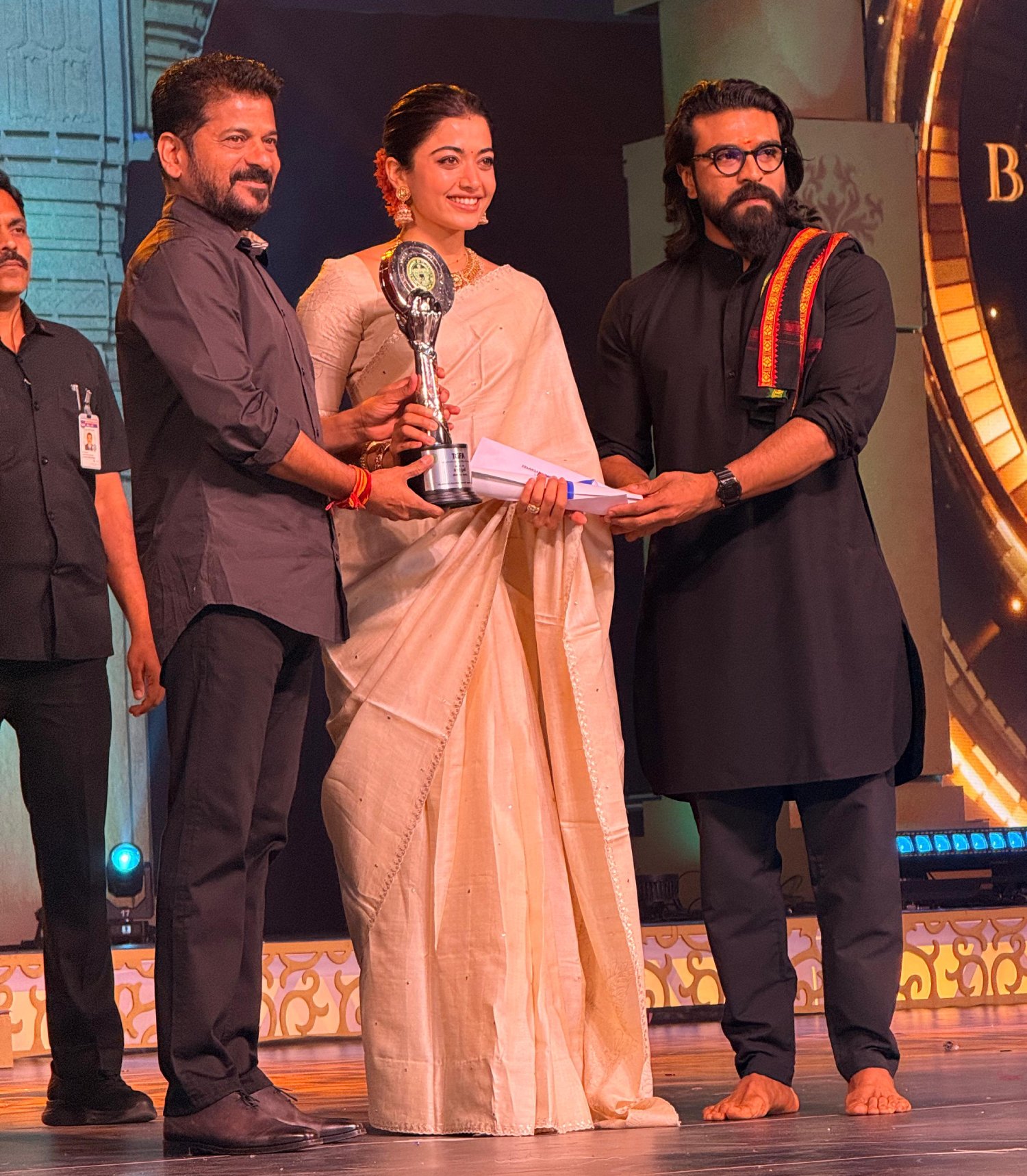 Rashmika Mandanna receiving Best Actress award from Revanth Reddy