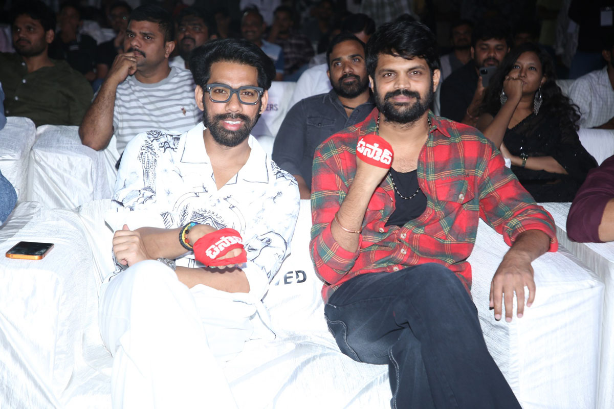 Kranthi Kumar Mahesh seated together at event