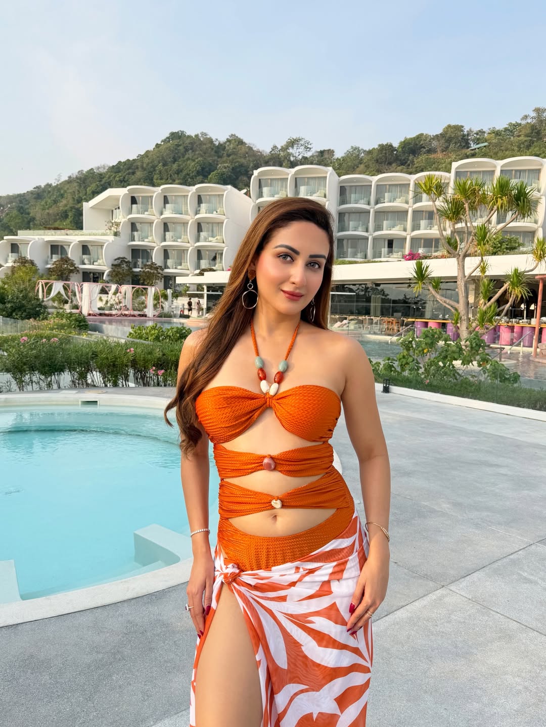 Zaara Yesmin bold orange outfit sunny stylish smile