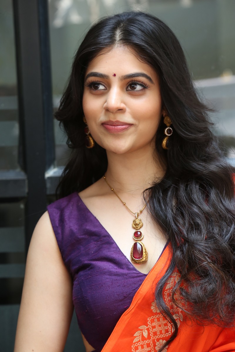 Bandhavi Sridhar orange saree traditional modern look