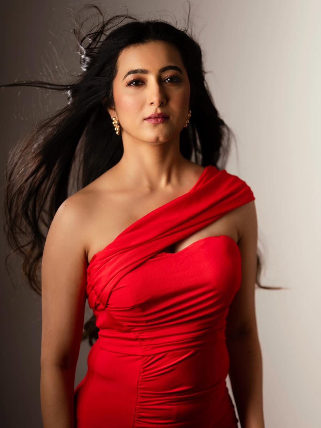 Adhvithi Shetty red dress flowing hair bold look